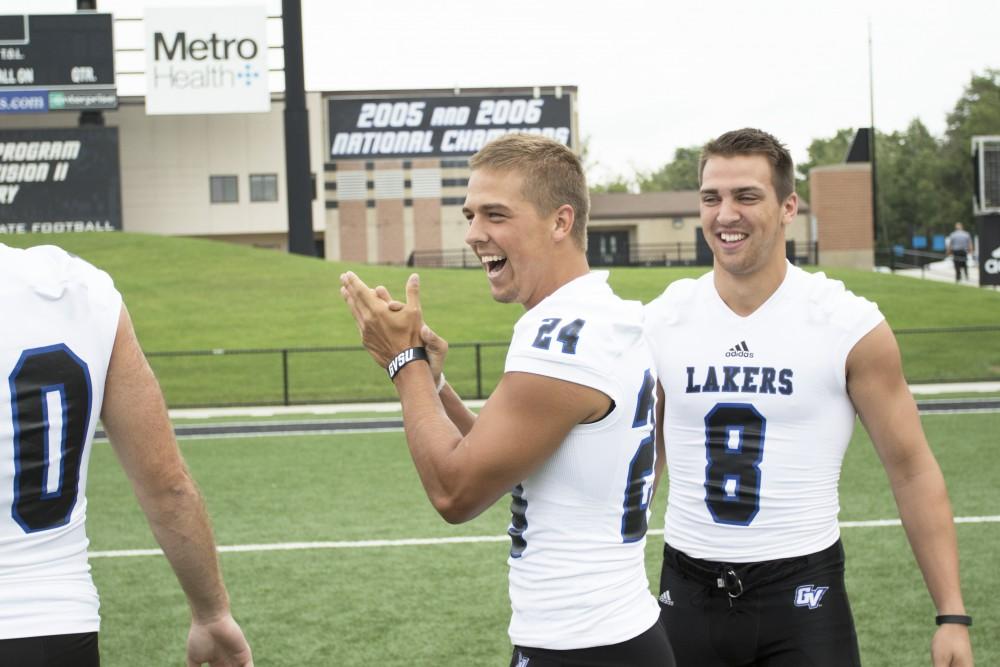 GVL / Kevin Sielaff
The Grand Valley State University football squad gathers for its annual media day Wednesday, August 19th, 2015. The afternoon aimed to promote the highly anticipated 2015 football season, while also making predictions for what the year ahead might hold. Matt Williams (24) laughs at Joe Robbins (8).   