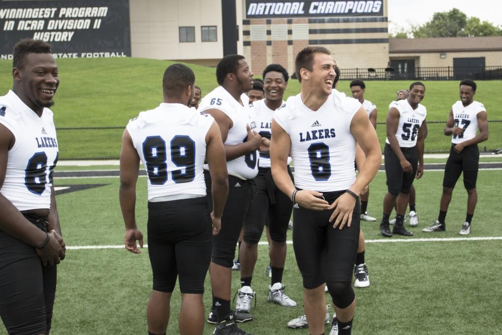 GVL / Kevin Sielaff
The Grand Valley State University football squad gathers for its annual media day Wednesday, August 19th, 2015. The afternoon aimed to promote the highly anticipated 2015 football season, while also making predictions for what the year ahead might hold. Joe Robbins (8) laughs at a joke.    