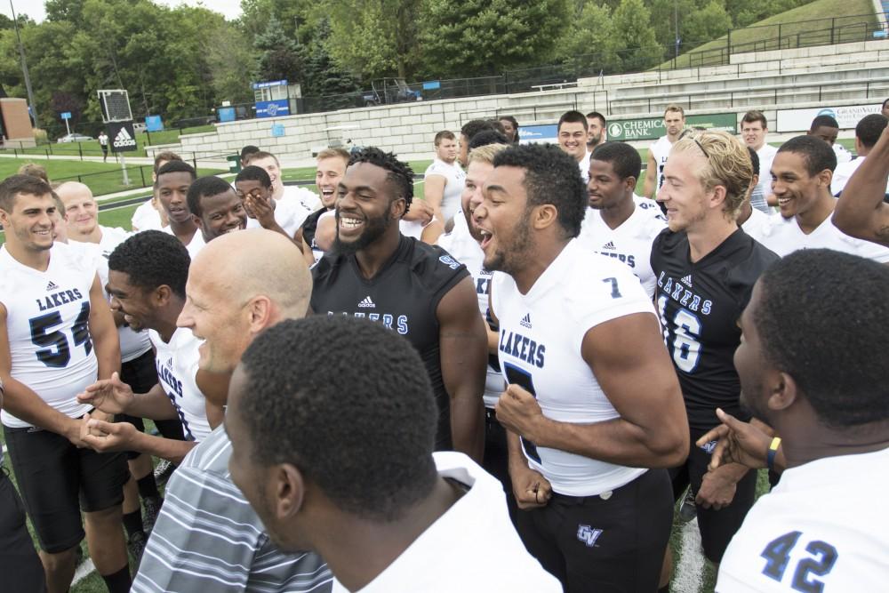 GVL / Kevin Sielaff
The Grand Valley State University football squad gathers for its annual media day Wednesday, August 19th, 2015. The afternoon aimed to promote the highly anticipated 2015 football season, while also making predictions for what the year ahead might hold. Matt Judon (9) and David Talley (7) joke in a group.  