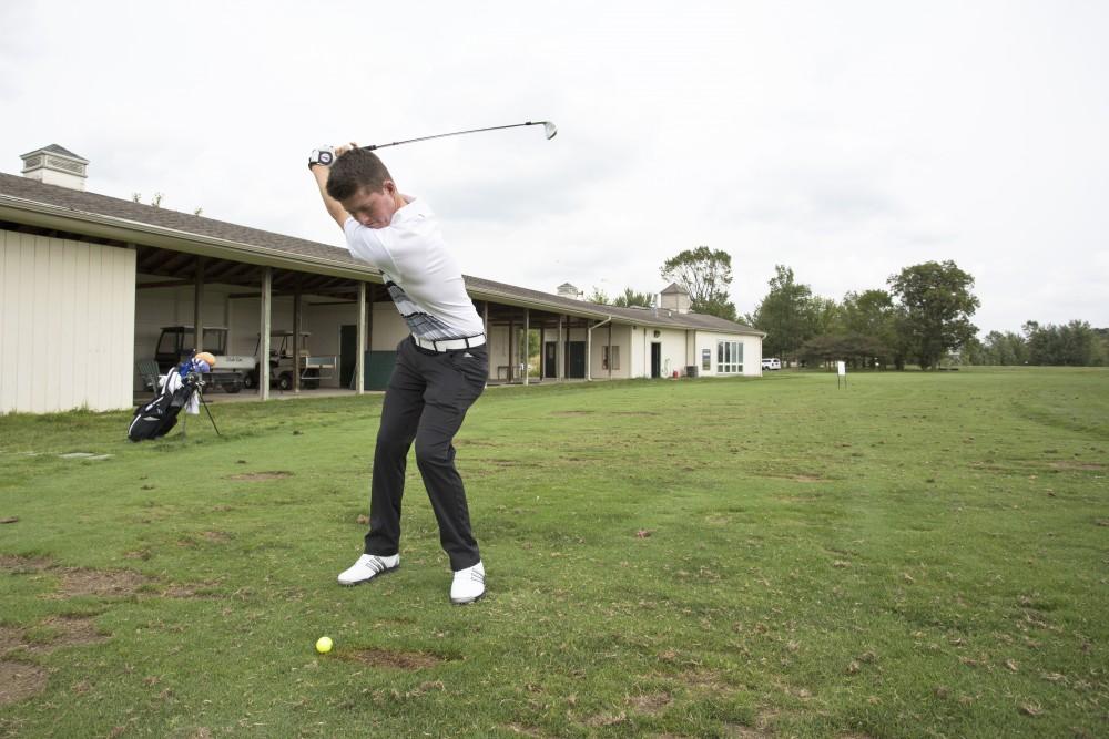 GVL / Kevin Sielaff
Freshman Bryce Messner leans back to take a swing Friday, August 28th, 2015.