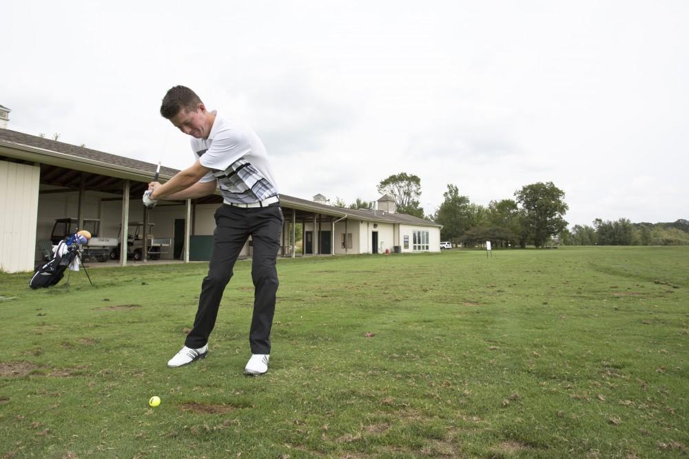 GVL / Kevin Sielaff
Freshman Bryce Messner leans back to take a swing Friday, August 28th, 2015. 