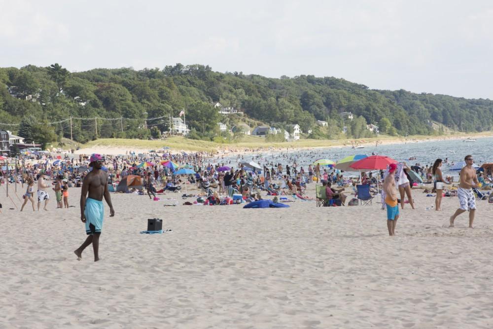 GVL / Kevin Sielaff    
Grand Haven State Park reaches its peak tourism season during mid-August as visitors benefit from the last of the summer's sun and waves - Saturday, August 22nd, 2015 drew massive crowds due to a cloudless sky and warm water temperatures. 