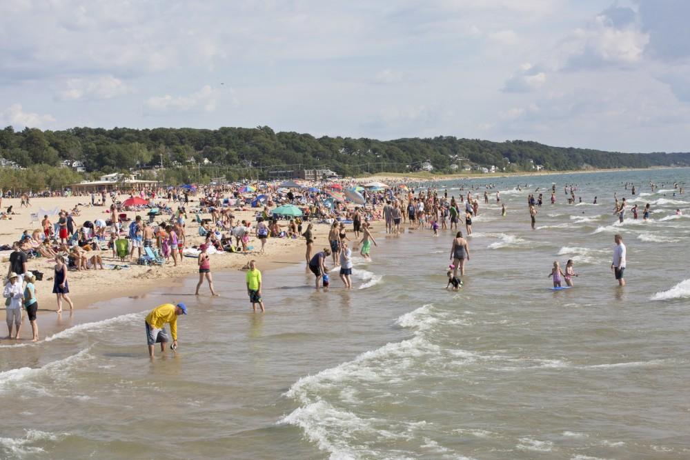 GVL / Kevin Sielaff    
Grand Haven State Park reaches its peak tourism season during mid-August as visitors benefit from the last of the summer's sun and waves - Saturday, August 22nd, 2015 drew massive crowds due to a cloudless sky and warm water temperatures. 