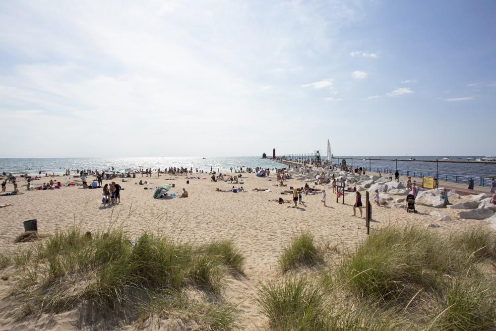 GVL / Kevin Sielaff    
Grand Haven State Park reaches its peak tourism season during mid-August as visitors benefit from the last of the summer's sun and waves - Saturday, August 22nd, 2015 drew massive crowds due to a cloudless sky and warm water temperatures. 