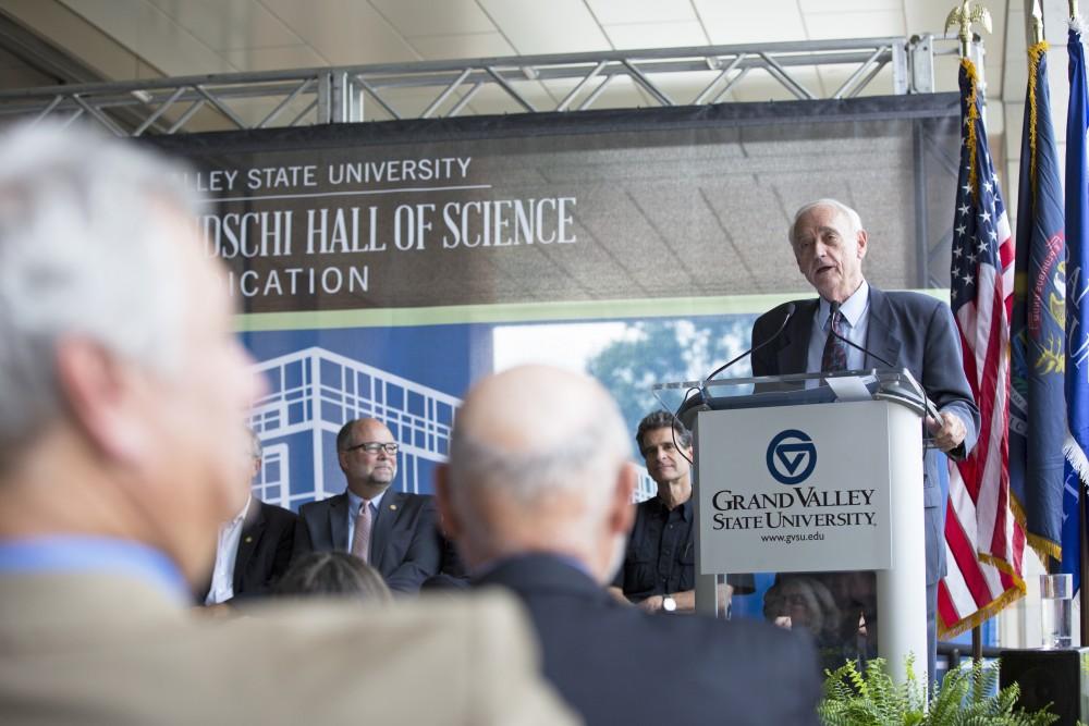 GVL / Kevin Sielaff
Former dean of math and sciences, P. Douglas Kindschi, speaks before the Kindschi Hall of Science. Grand Valley celebrates the P. Douglas Kindschi Hall of Science with a dedication ceremony Friday, August 28th, 2015. The dedication recognized both Grand Valley and state officials that made the realization of this building possible. 