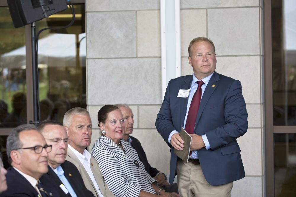 GVL / Kevin Sielaff
Peter MacGregor joins the festivities in front of the new science hall. Grand Valley celebrates the P. Douglas Kindschi Hall of Science with a dedication ceremony Friday, August 28th, 2015. The dedication recognized both Grand Valley and state officials that made the realization of this building possible. 