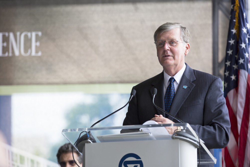 GVL / Kevin Sielaff
President Thomas Haas speaks to the crowds gathered at the dedication of the Kindschi Hall of Science. Grand Valley celebrates the P. Douglas Kindschi Hall of Science with a dedication ceremony Friday, August 28th, 2015. The dedication recognized both Grand Valley and state officials that made the realization of this building possible. 