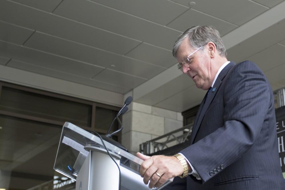 GVL / Kevin Sielaff
President Thomas Haas speaks to the crowds gathered at the dedication of the Kindschi Hall of Science. Grand Valley celebrates the P. Douglas Kindschi Hall of Science with a dedication ceremony Friday, August 28th, 2015. The dedication recognized both Grand Valley and state officials that made the realization of this building possible. 