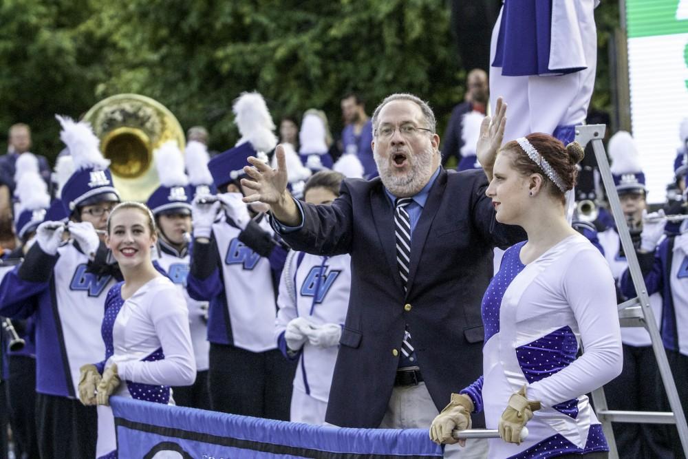 GVL / Sara Carte
Grand Valley Marching Band Director, Dr. John D Martin, leads the crowd in the fight song on opening night of Art Prize on Sept. 23.