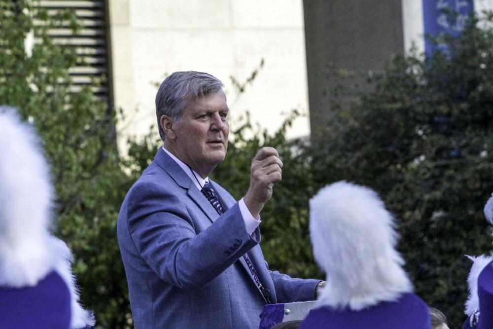 GVL / Sara Carte
Grand Valley’s President, Thomas J. Haas, leads the marching band with their fight song for the opening night of Art Prize in the Rosa Parks Circle on Sept. 23.