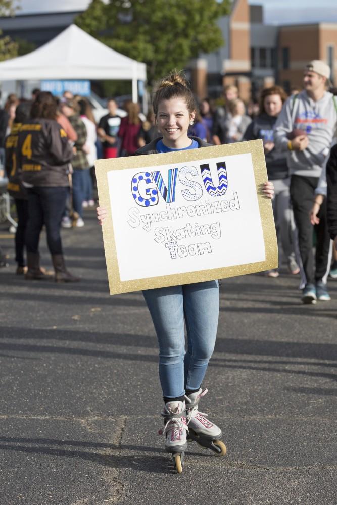 GVL/Kevin Sielaff
Juliana Barla skates around the venue holding a sign for Grand Valley's synchronized skating team. Campus Life Night takes place Sept. 13 on the grounds of parking lot H at Grand Valley's Allendale campus. 