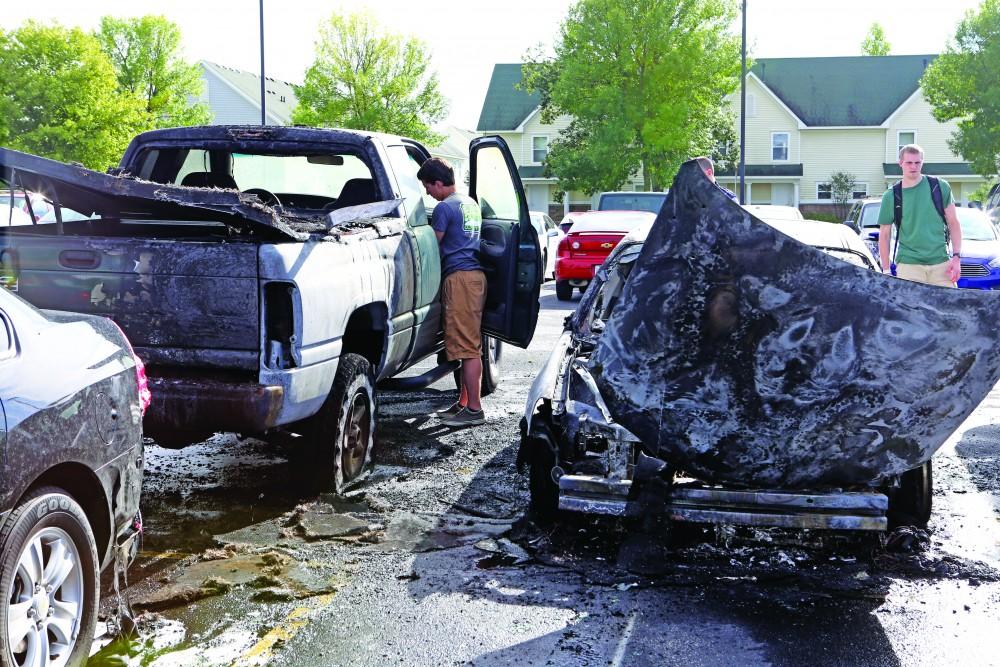 GVL / Emily Frye  
The unfortunate GVSU student at the scene of what is left of his pick-up truck on Sep. 9th.