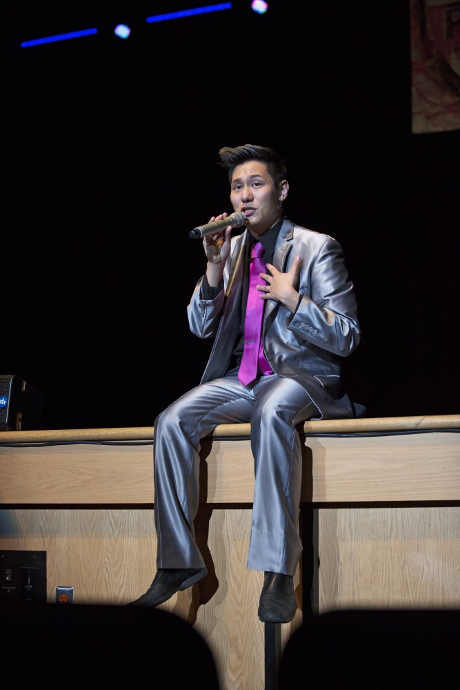 GVL / Kevin Sielaff
Peter Yang speaks to the crowd. The Cat's Pajamas, a nationally known vocal band, headlines a concert including Grand Valley's all-women a cappella group Midnight Snack and local high school group vocalists. 