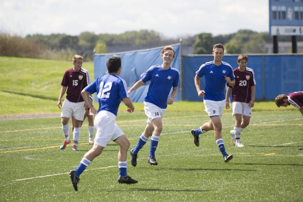 GVL/Kevin Sielaff
The team celebrates Casey Hagan's goal. Grand Valley's club soccer team squares off against Central Michigan Sept. 12 at the intramural field. 