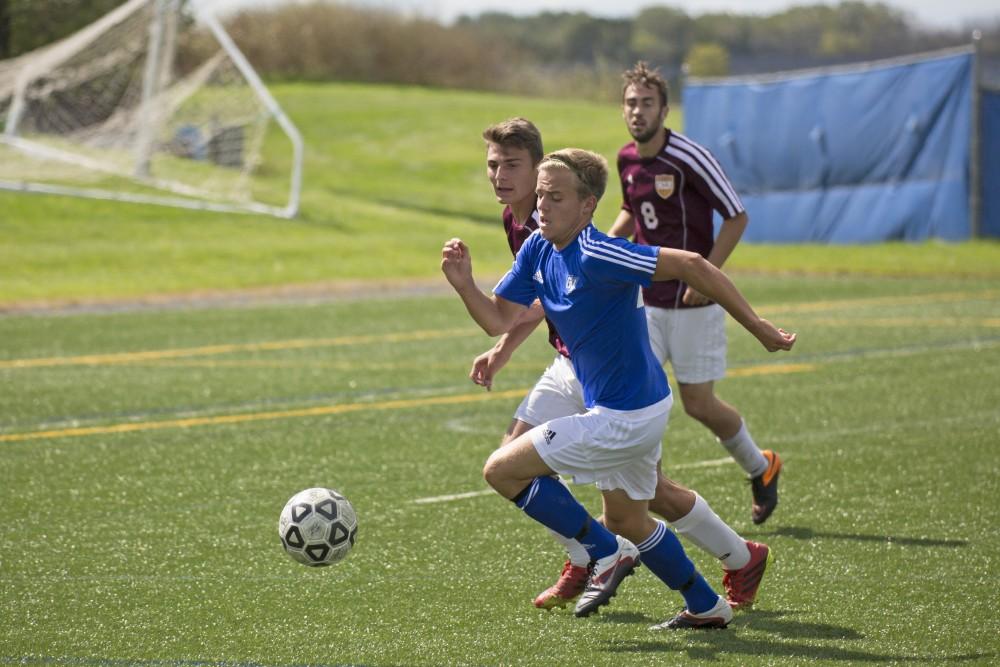 GVL/Kevin Sielaff
Chase Nielson chases after the ball. Grand Valley's club soccer team squares off against Central Michigan Sept. 12 at the intramural field. 