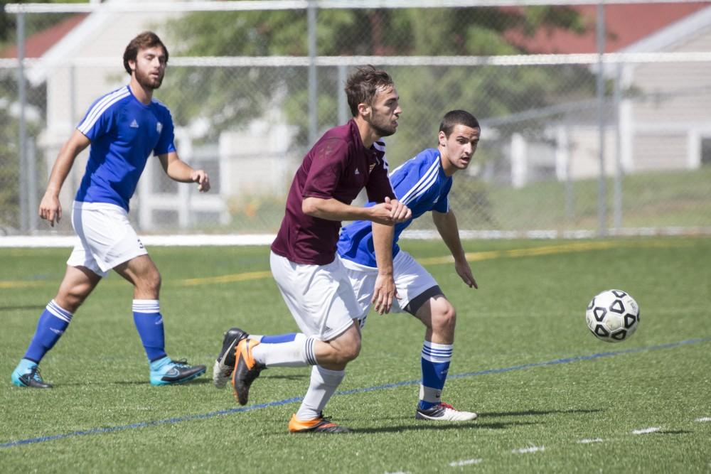 GVL/Kevin Sielaff
Robert Klein looks to steal the ball. Grand Valley's club soccer team squares off against Central Michigan Sept. 12 at the intramural field. 