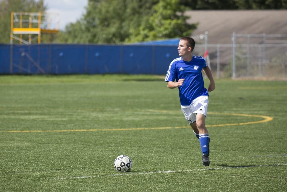 GVL/Kevin Sielaff
Jacob Arvidson looks to pass the ball upfield. Grand Valley's club soccer team squares off against Central Michigan Sept. 12 at the intramural field. 