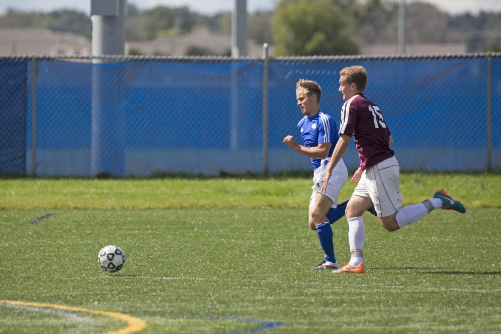 GVL/Kevin Sielaff
Chase Nielson hunts down the ball. Grand Valley's club soccer team squares off against Central Michigan Sept. 12 at the intramural field. 