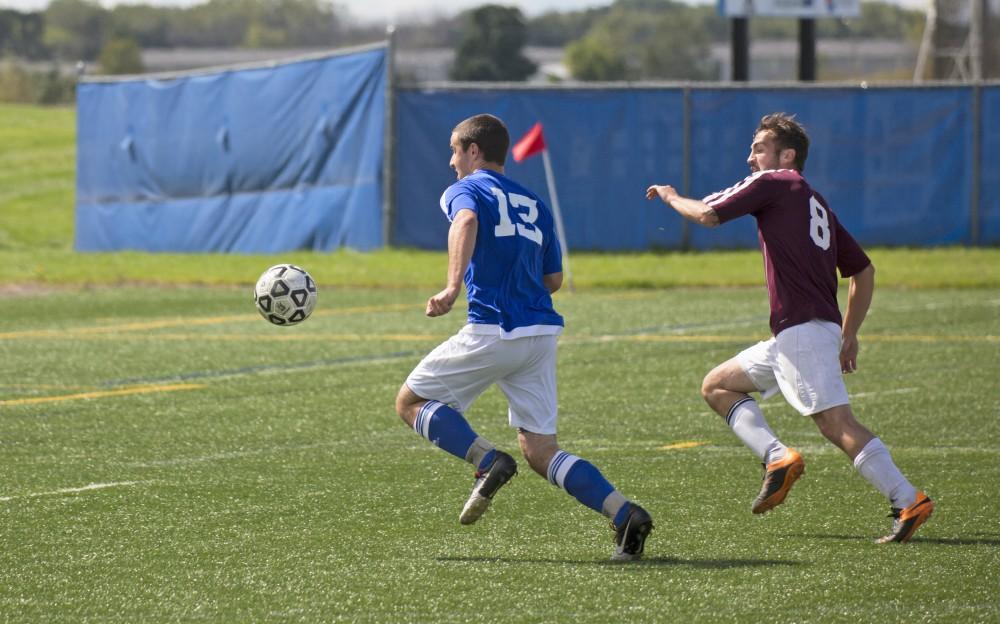 GVL/Kevin Sielaff
Robert Klein move the ball toward the net. Grand Valley's club soccer team squares off against Central Michigan Sept. 12 at the intramural field. 