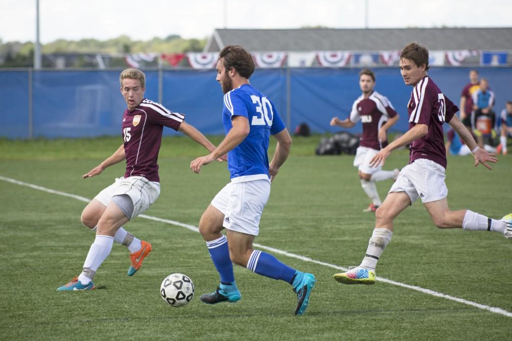 GVL/Kevin Sielaff
Paul Bump pushes the ball upfield. Grand Valley's club soccer team squares off against Central Michigan Sept. 12 at the intramural field. 