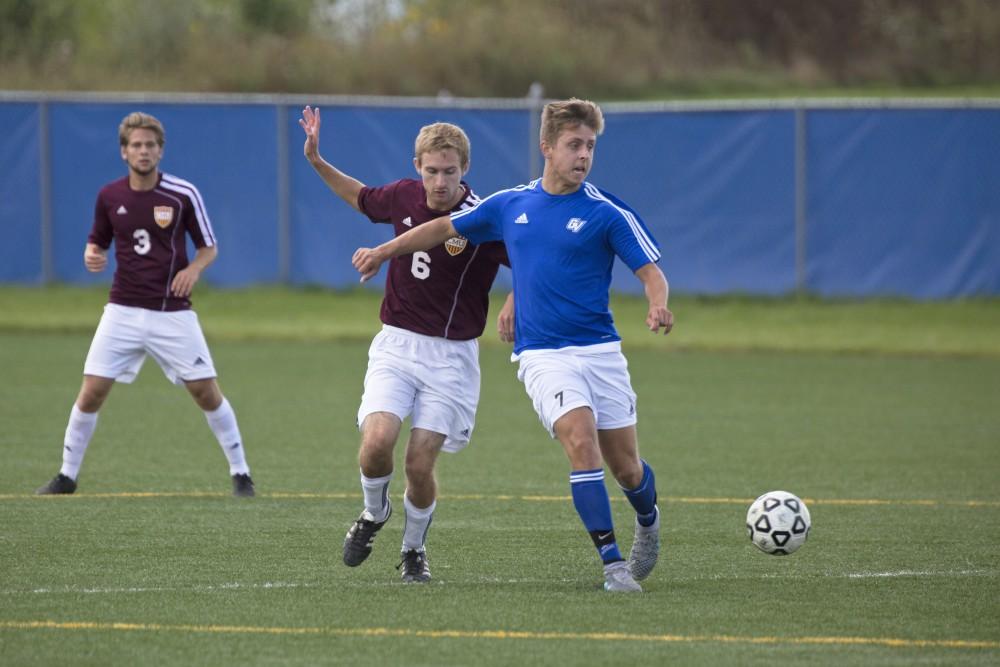 GVL/Kevin Sielaff
Ryan Markiewicz passes the ball. Grand Valley's club soccer team squares off against Central Michigan Sept. 12 at the intramural field. 