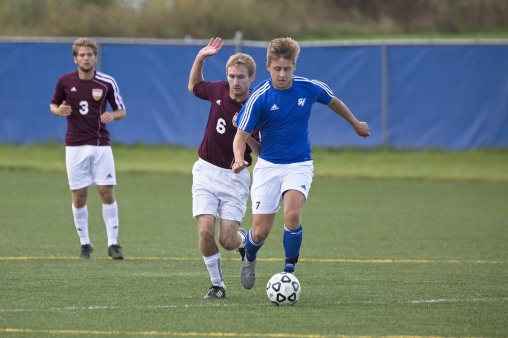 GVL/Kevin Sielaff
Ryan Markiewicz dribbles around midfield. Grand Valley's club soccer team squares off against Central Michigan Sept. 12 at the intramural field. 