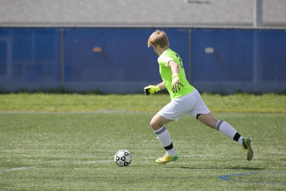 GVL/Kevin Sielaff
Keep David Bump clears the ball. Grand Valley's club soccer team squares off against Central Michigan Sept. 12 at the intramural field. 