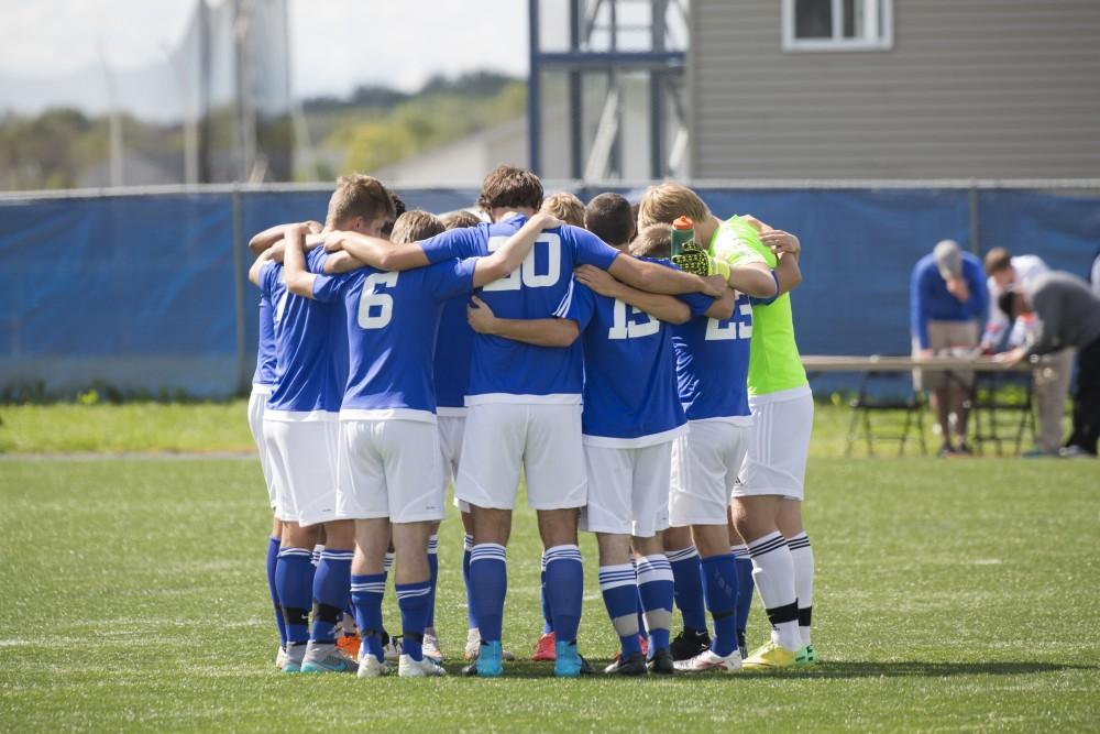 GVL/Kevin Sielaff
The team huddles before the game. Grand Valley's club soccer team squares off against Central Michigan Sept. 12 at the intramural field. 