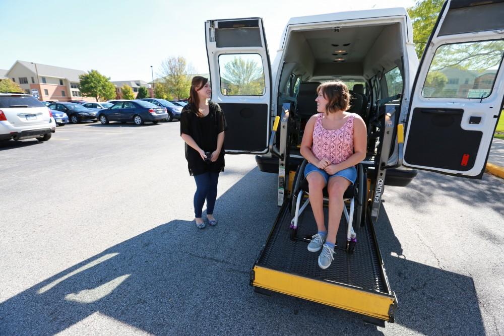 GVL/Kevin Sielaff 
Van operater Jenna Bud and student Sara Krahel use the vans lift on Sept. 23.
