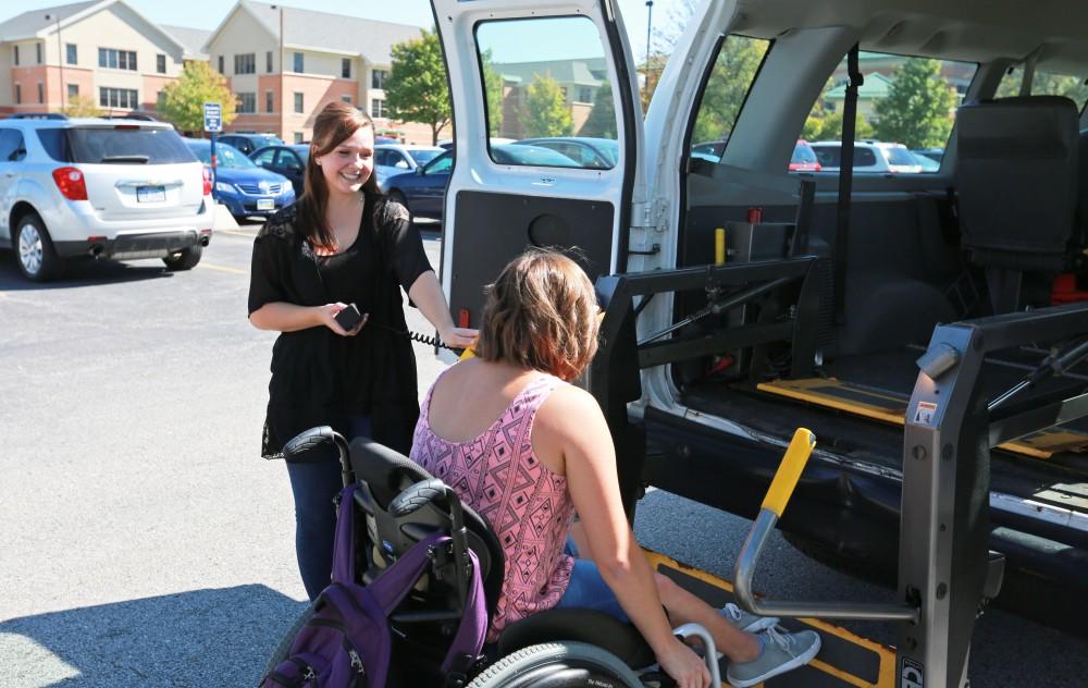 GVL/Kevin Sielaff 
Van operater Jenna Bud and student Sara Krahel use the van's lift on Sept. 23.