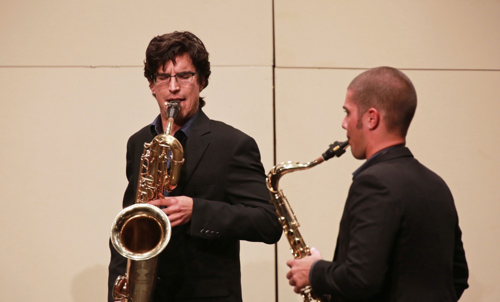 GVL / Kevin Sielaff
Danny Hawthorne-Foss and Joseph Girard play together on stage as part of the Donald Sinta Quartet.  The GVSU music department presents a faculty concert as a part of Fall Art Celebration Sept. 21 in the Louis Armstrong Theatre. 