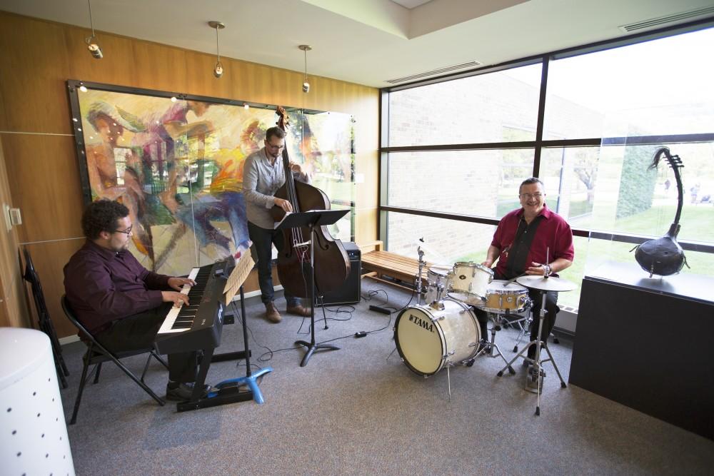 GVL/Kevin Sielaff
A band plays outside the art gallery in the PAC center. The annual Fall Arts Celebration unveils the "Dusk to Dusk: Unsettled, Unraveled, Unreal" exhibit Sept. 10 inside the Performing Arts Center on Grand Valley's Allendale campus.