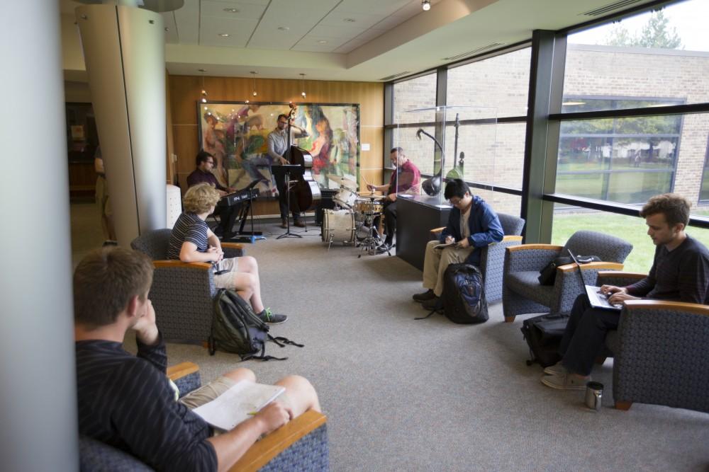 GVL/Kevin Sielaff
A band plays just outside the entrance to the art gallery as students listen. The annual Fall Arts Celebration unveils the "Dusk to Dusk: Unsettled, Unraveled, Unreal" exhibit Sept. 10 inside the Performing Arts Center on Grand Valley's Allendale campus.