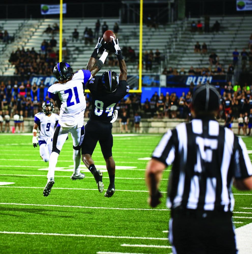 GVL / Kevin Sielaff 
Urston Smith (84) reaches up to grab a pass. Grand Valley State squares off against Southwest Baptist Thursday, September 3rd, 2015 at Lubbers Stadium. 