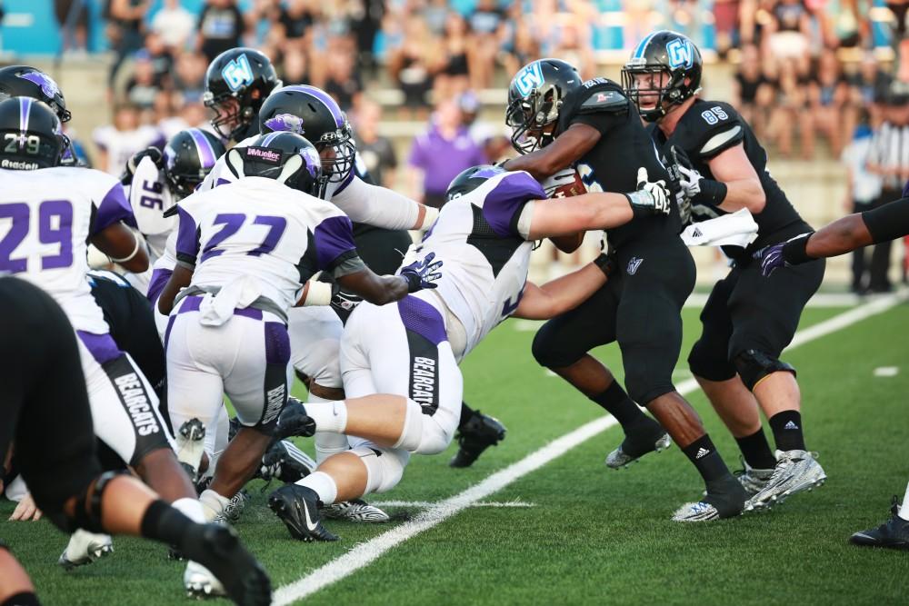 GVL / Kevin Sielaff
Grand Valley State squares off against Southwest Baptist Thursday, September 3rd, 2015 at Lubbers Stadium. Jalen Bryant (26) runs the ball through Southwest's defense.