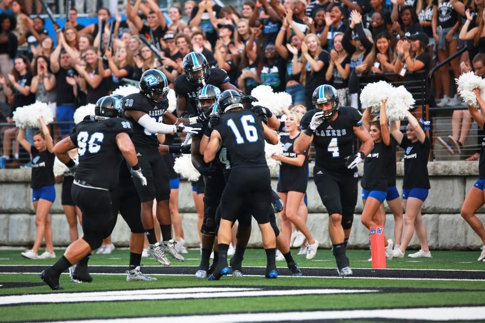 GVL / Kevin Sielaff 
The Lakers celebrate after a touchdown. Grand Valley State squares off against Southwest Baptist Thursday, September 3rd, 2015 at Lubbers Stadium. 