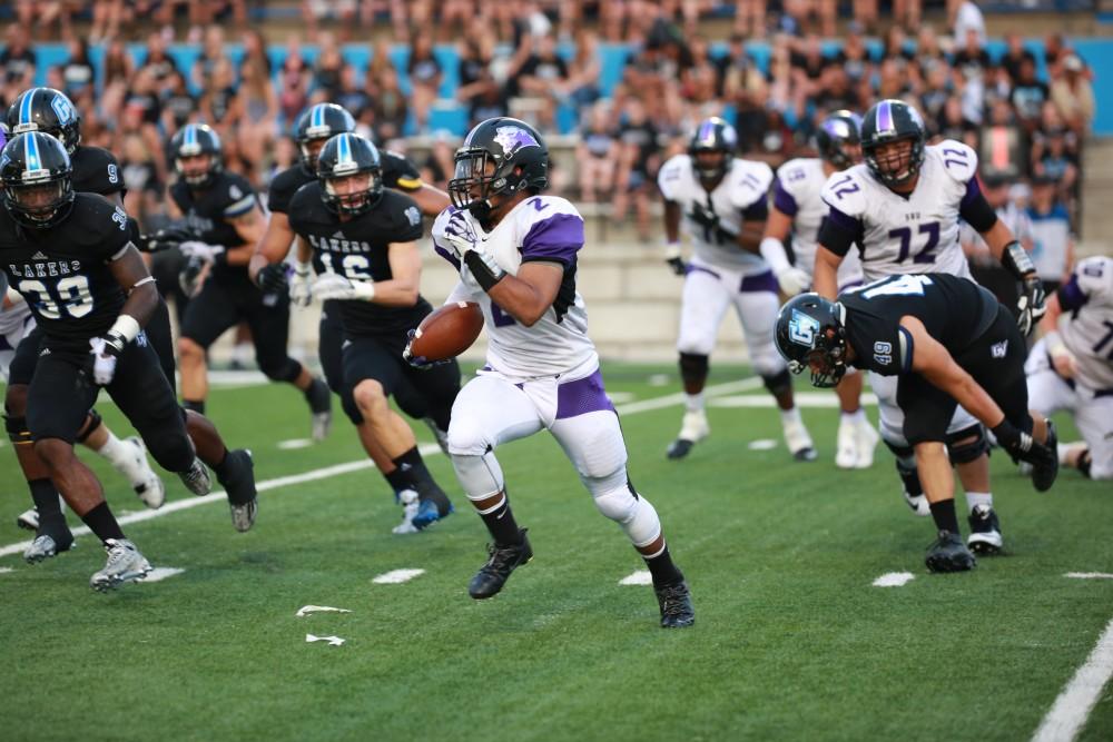 GVL / Kevin Sielaff 
Southwest running back Nehemiah Gross (2) fleas from the GV defense. Grand Valley State squares off against Southwest Baptist Thursday, September 3rd, 2015 at Lubbers Stadium. 