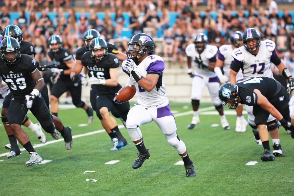 GVL / Kevin Sielaff 
Southwest running back Nehemiah Gross (2) fleas from the GV defense. Grand Valley State squares off against Southwest Baptist Thursday, September 3rd, 2015 at Lubbers Stadium. 