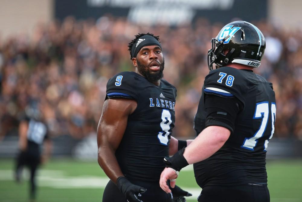 GVL / Kevin Sielaff 
Matt Judon (9) and Derek DeLuca (74) observe the field after a play. Grand Valley State squares off against Southwest Baptist Thursday, September 3rd, 2015 at Lubbers Stadium. 