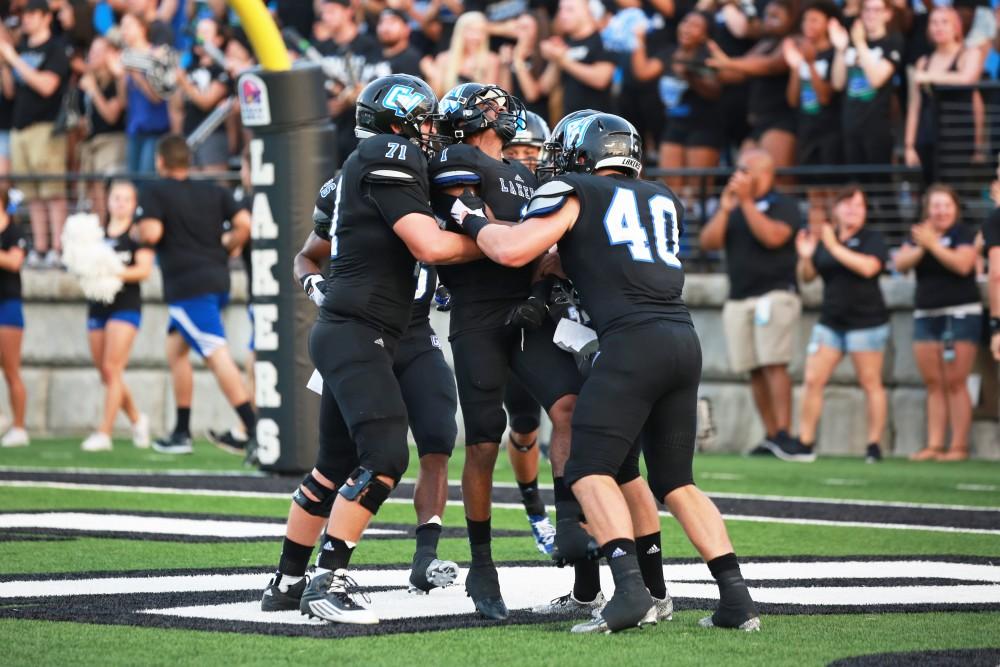 GVL / Kevin Sielaff 
The Lakers celebrate after a touchdown. Grand Valley State squares off against Southwest Baptist Thursday, September 3rd, 2015 at Lubbers Stadium. 