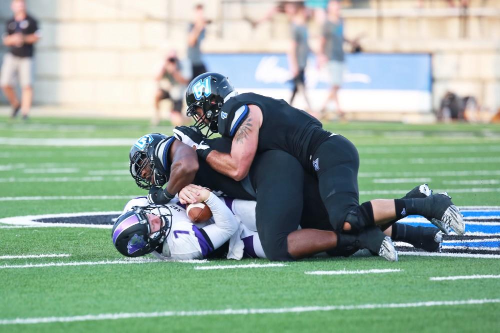 GVL / Kevin Sielaff 
Matt Judon (9) sacks the opposing quarterback. Grand Valley State squares off against Southwest Baptist Thursday, September 3rd, 2015 at Lubbers Stadium. 