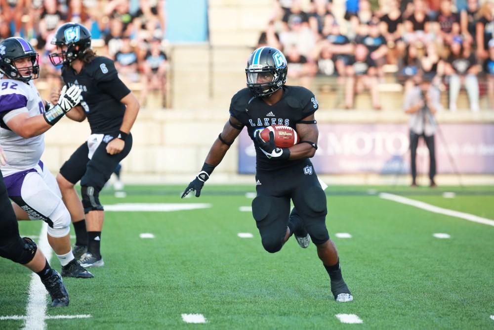 GVL / Kevin Sielaff 
Martayveous Carter (34) looks to drive the ball upfield. Grand Valley State squares off against Southwest Baptist Thursday, September 3rd, 2015 at Lubbers Stadium. 