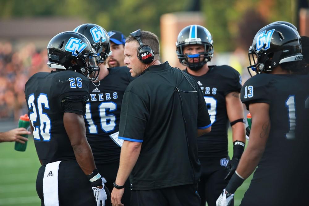 GVL / Kevin Sielaff 
Head coach Matt Mitchell talks to his team in a huddle. Grand Valley State squares off against Southwest Baptist Thursday, September 3rd, 2015 at Lubbers Stadium. 