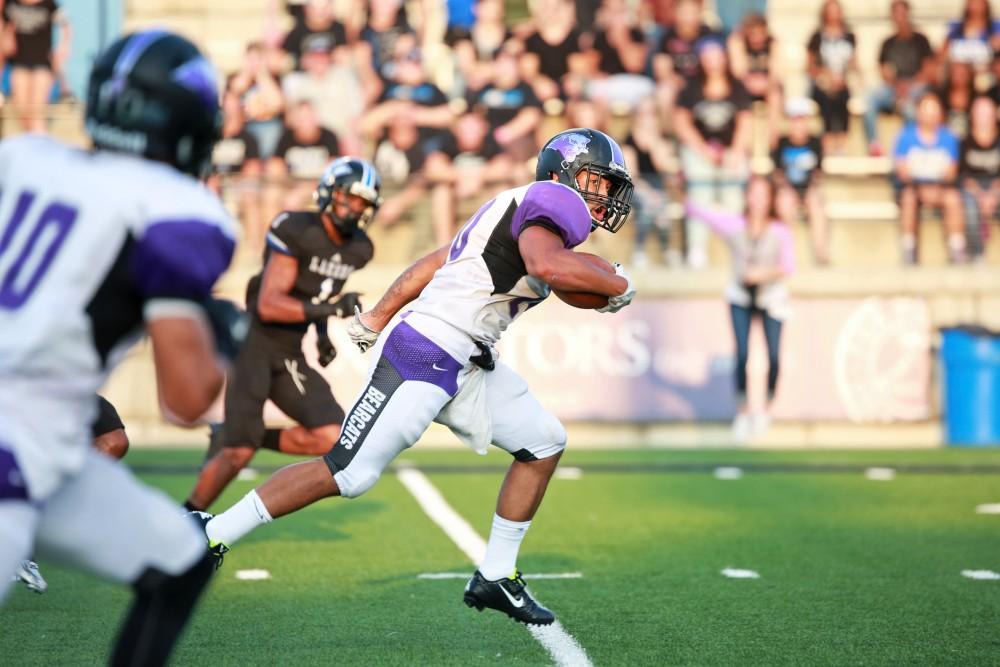 GVL / Kevin Sielaff 
Bubba Jenkins (20) of Southwest Baptist drives the ball toward the GV endzone. Grand Valley State squares off against Southwest Baptist Thursday, September 3rd, 2015 at Lubbers Stadium. 