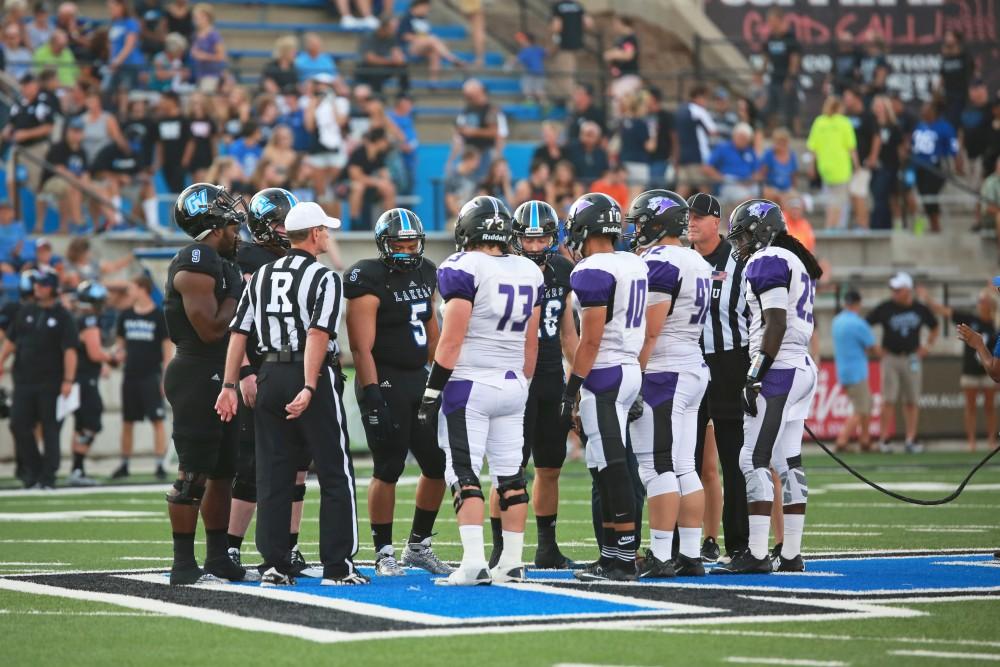 GVL / Kevin Sielaff 
The two teams flip a coin at the start of the game to determine posession. Grand Valley State squares off against Southwest Baptist Thursday, September 3rd, 2015 at Lubbers Stadium. 