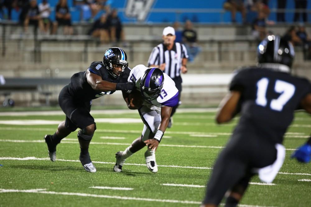 GVL / Kevin Sielaff 
Matt Judon (9) brings down a Southwest running back. Grand Valley State squares off against Southwest Baptist Thursday, September 3rd, 2015 at Lubbers Stadium. 