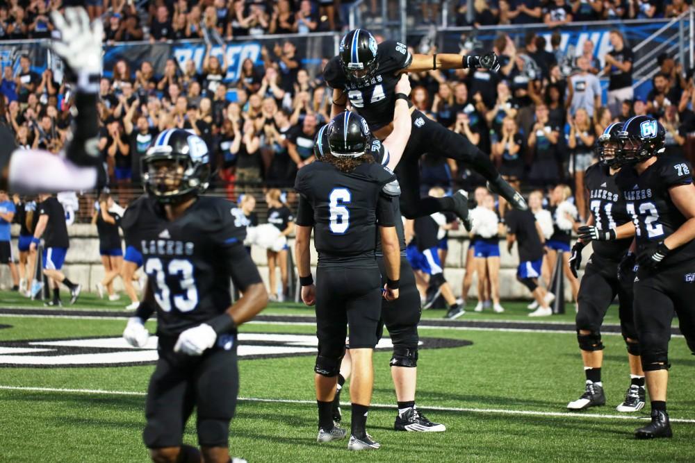 GVL / Kevin Sielaff 
Matt Williams (24) celebrates with his teammates after a touchdown. Grand Valley State squares off against Southwest Baptist Thursday, September 3rd, 2015 at Lubbers Stadium. 