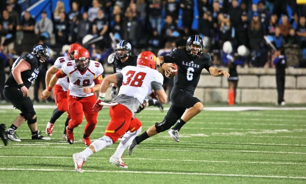 GVL / Kevin Sielaff     Bart Williams (6) attempts to evade a sack. Grand Valley State University squares off against Ferris State University Sept. 19 at Lubbers Stadium in Allendale. The Lakers were defeated, with a final score of 61-24.