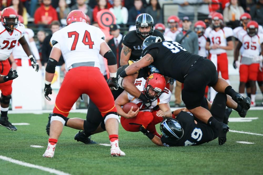 GVL / Kevin Sielaff     Ferris quarterback Jason Vander Laan (15) is sacked. Grand Valley State University squares off against Ferris State University Sept. 19 at Lubbers Stadium in Allendale. The Lakers were defeated, with a final score of 61-24.