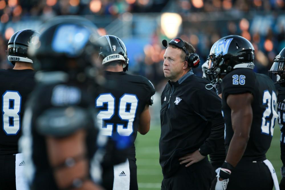 GVL / Kevin Sielaff     Head coach Matt Mitchell speaks to his players in a huddle. Grand Valley State University squares off against Ferris State University Sept. 19 at Lubbers Stadium in Allendale. The Lakers were defeated, with a final score of 61-24.